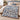 Yuletide Keepsake Patchwork woven blanket in blue spread across a bed, vintage Christmas patchwork throw