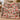Personalized Yuletide Keepsake Patchwork woven blanket in pink draped on a sofa with sample family name The Thompsons above the toy train