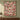 Yuletide Keepsake Patchwork woven blanket in pink hung as a Christmas wall tapestry with sample family name The Thompsons