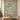 Yuletide Keepsake Patchwork woven blanket in sage hung as a Christmas wall tapestry with sample family name The Thompsons