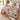 Snowfall Paper Village Christmas woven blanket spread across a bed