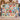 Couple holding a personalized Christmas Toy Cupboard fleece blanket with sample family name The Bennetts
