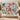 Christmas Toy Cupboard fleece blanket hung on a wall with sample family name