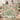 Couple holding a personalized Bleeding Heart and Brunnera fleece blanket with sample name The Thompson Family