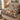 Peaceable Kingdom Lion and Lamb quilt bedding set on a wooden bed in a bright bedroom