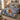 Bethlehem Lily Nativity Christmas quilt bedding set with 2 matching pillowcases on a bed beside a window
