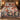 Christmas Carousel Garden comforter set with 2 matching pillowcases on a bed in a festive bedroom
