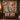 Christmas Carousel Garden quilt hung on a wall above a bench with 2 matching pillowcases