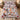 Christmas Dogs Poinsettia quilt bedding set with 2 matching pillowcases on a bed, 25 festive dogs among red poinsettias