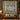 Birch Lake Wildflower Meadow quilt hung on a wall with sample family name The Ellsworth Family above a bench with 2 matching pillowcases