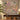 Clouded leopard orchid jungle woven blanket hung as a wall tapestry above a console table