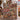 Holding a personalized red barn harvest woven blanket with custom name woven in