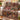 Red barn harvest woven blanket draped over a sofa