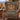 Red-Tailed Hawk Sun Medallion woven blanket draped over a plaid wingback chair