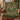 Red Toadstool Fern Wreath woven blanket styled on an armchair