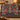 Personalized River Birch Cardinal Parade woven blanket with custom family name draped over a sofa by a Christmas tree