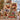 Couple holding a personalized Robin Ribbon Parade Christmas photo blanket with 6 family photos and custom family name