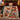 Robin Ribbon Parade Christmas photo blanket spread on a bed in a holiday bedroom