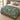Sage Hellebore Ornament Christmas woven blanket spread across a bed in a Christmas bedroom
