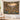 Saguaro Bloom Desert Garden Heritage woven blanket hanging as a wall tapestry in a cabin-style room