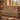 Saguaro Bloom Tree of Life woven blanket draped over a sofa in a living room