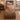 Sandhill crane sunrise woven blanket spread on a bed