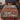 Red barn and Christmas gnome woven blanket spread on a bed