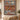 Scandinavian Christmas Gnome Farm woven blanket displayed as a wall tapestry above a wooden bench