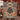 Couple holding a personalized Scandinavian Christmas Straw Goat woven blanket with custom family name woven in