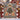 Scandinavian Christmas Straw Goat woven blanket displayed outdoors on a red fence with a straw Yule goat