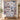 Personalized Silver Wolves Moon quilt with custom family name hung on a wall above a bench with matching pillowcases