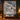 Personalized Snow Hare Enchanted Forest quilt with custom family name hung on a wall above a bench with matching pillowcases