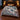 Snow Hare Enchanted Forest woven blanket with custom family name spread on a bed