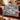 Snow Hare Enchanted Forest woven blanket with custom family name draped over a sofa, holiday room view