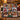 Snowflake Quilt Christmas photo blanket with family photos draped over a sofa by a Christmas tree