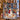 Couple holding a personalized Snowman Lantern Walk Christmas photo blanket with 7 family photos and custom family name