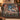 Personalized Snowy River Birch Cardinals woven blanket with custom family name draped over a sofa by a Christmas tree