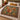 Squirrel Family Hazel Bower woven blanket spread on a bed