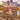 Couple holding a personalized Sunrise Balloon Valley woven blanket with custom names in an autumn river valley