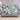 Swan Iris Pond woven blanket draped over a sofa