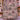 Holding a personalized Sweet Spooky Storybook Village woven blanket with custom family name woven in