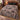 Sweet Spooky Storybook Village woven blanket spread on a bed