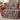 Sweet Spooky Storybook Village woven blanket draped over a sofa