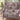 Sweet Spooky Storybook Village woven blanket styled on an armchair