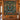 Tamarack Moose Lake Medallion woven blanket displayed as a wall tapestry on a log cabin wall above a wooden console