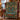 Tamarack Moose Lake Medallion woven blanket draped over a red plaid armchair
