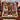 Personalized Tartan Ribbon Christmas photo blanket with nine family photos on a plaid armchair