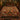 Terracotta Acanthus Tree of Life woven blanket with custom family name spread on a bed
