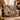 Tufted Titmouse Winter Skimmia woven blanket draped over a sofa in a holiday living room