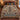 Twin reindeer and spruce tree ornamental woven blanket spread on a bed